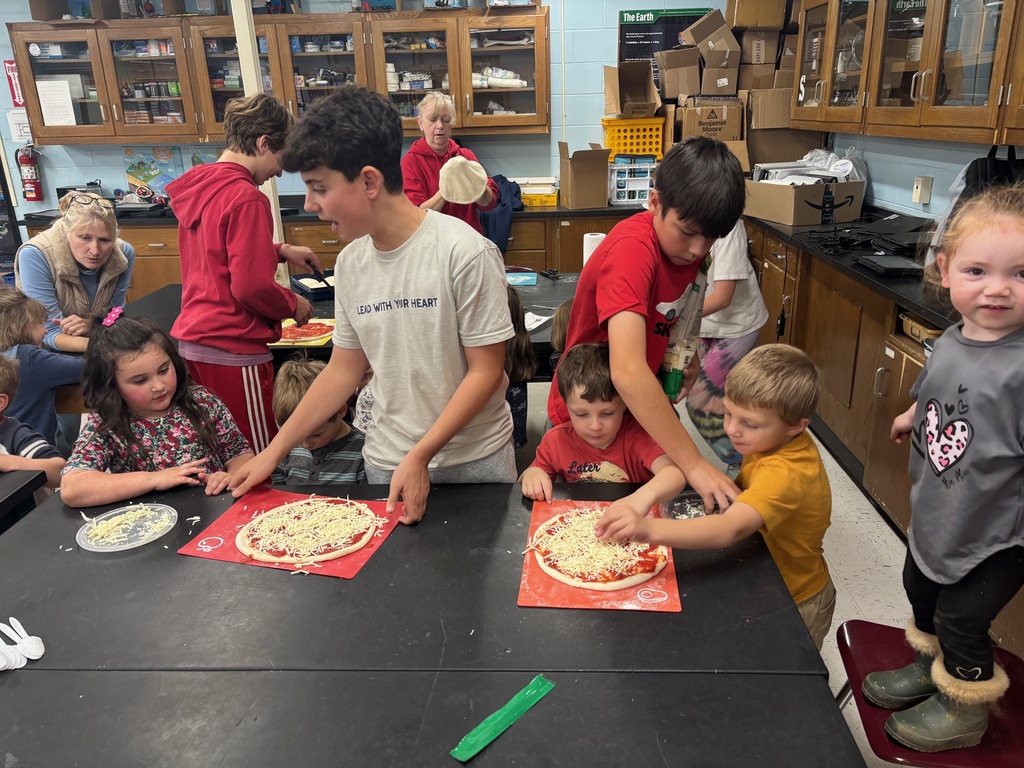 Pre-k got to try out their pizza making skills with the help of some 7th and 8th graders