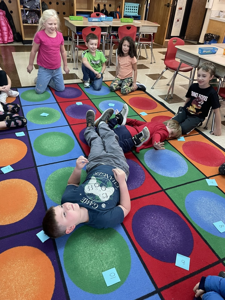 Mrs. Ettinger's class learned about telling time by jumping around the clock and making a human clock!
