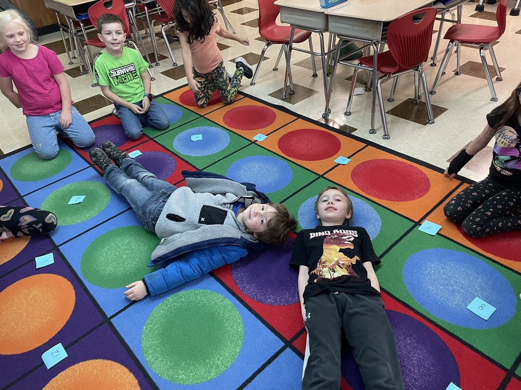 Mrs. Ettinger's class learned about telling time by jumping around the clock and making a human clock!