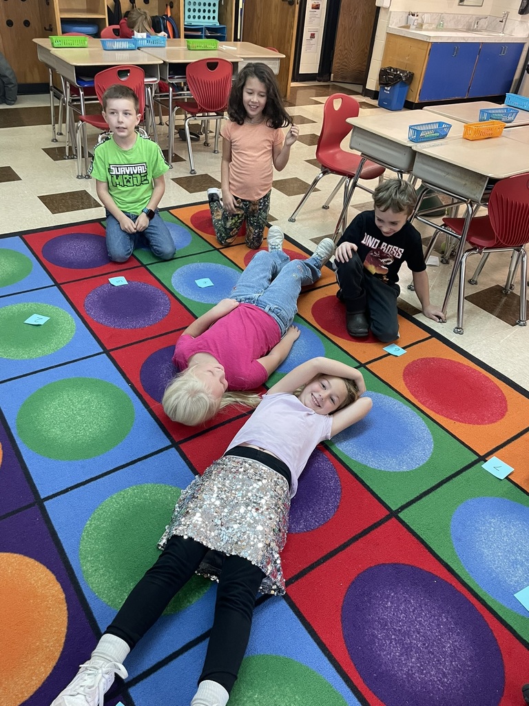 Mrs. Ettinger's class learned about telling time by jumping around the clock and making a human clock!