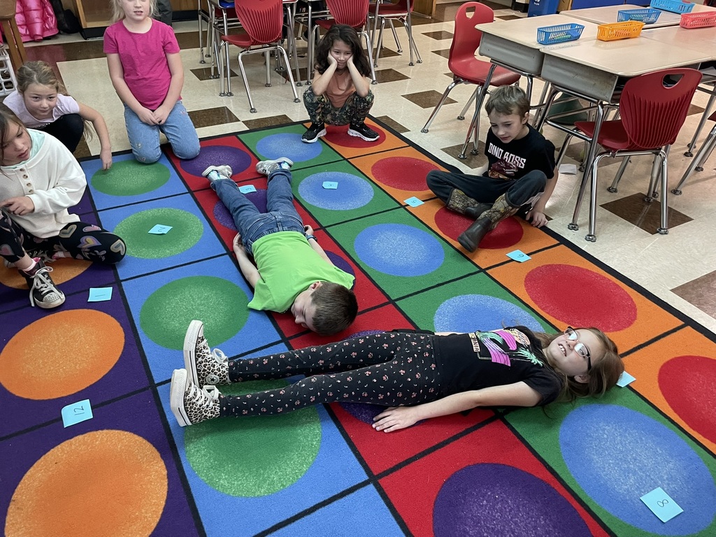 Mrs. Ettinger's class learned about telling time by jumping around the clock and making a human clock!