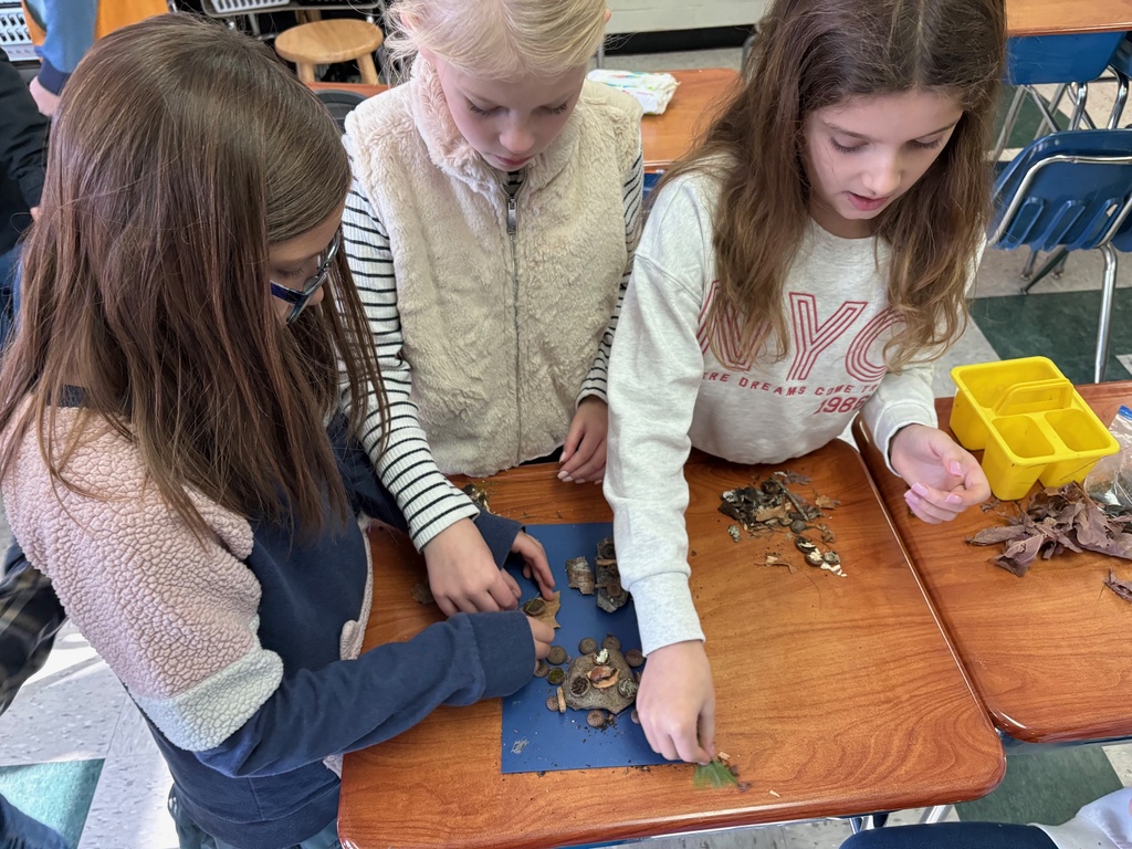 Mrs. Tibbett's class making miniature Thanksgiving dinner for our Lost Civilization.