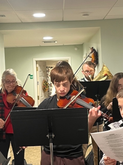 7/8 Music Students caroling at Coves Edge