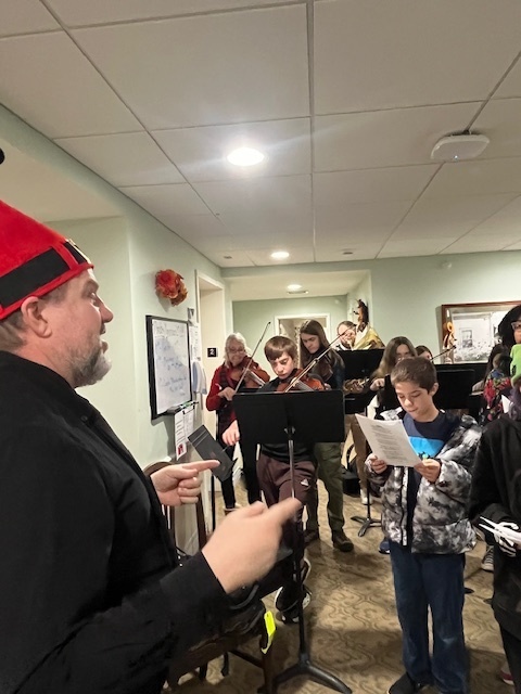 7/8 Music Students caroling at Coves Edge