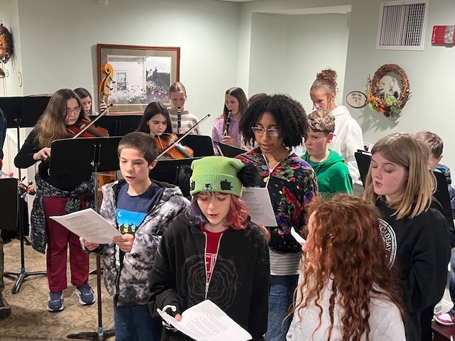 7/8 Music Students caroling at Coves Edge