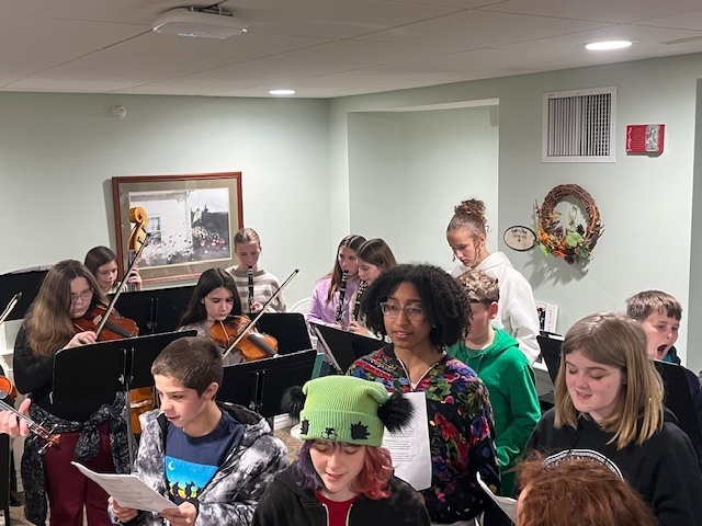 7/8 Music Students caroling at Coves Edge