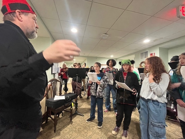 7/8 Music Students caroling at Coves Edge