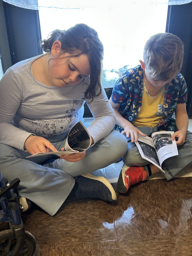 Reading with a partner in Mrs. Michaud’s class about holidays around the world. 