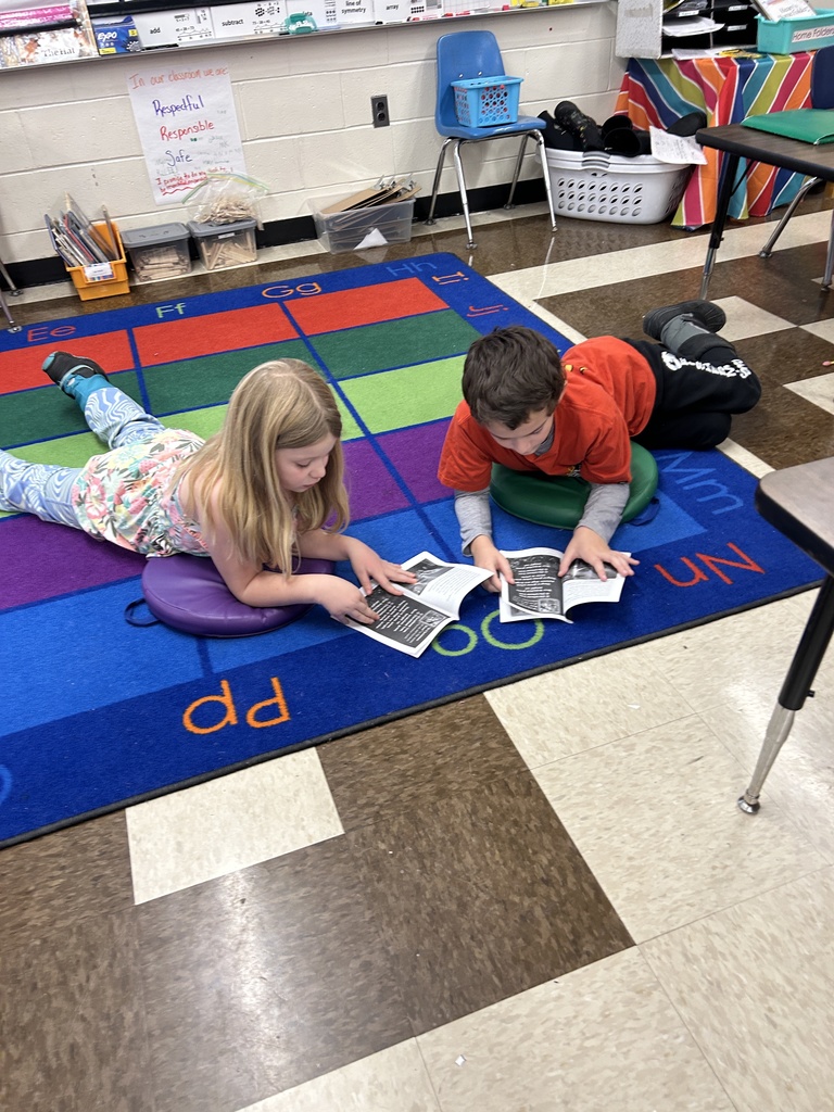 Reading with a partner in Mrs. Michaud’s class about holidays around the world. 