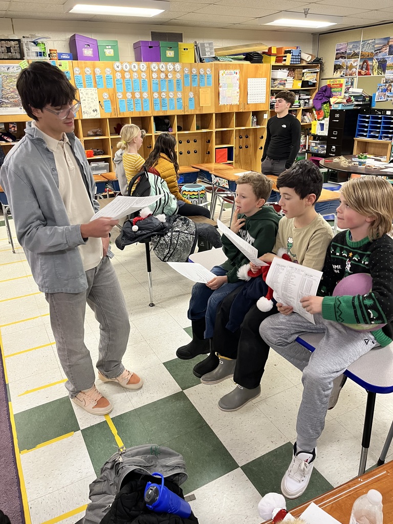 Lincoln academy international students conversing with 5th and 6th graders while sipping on Colombian hot chocolate that traditionally includes adding mozzarella cheese!