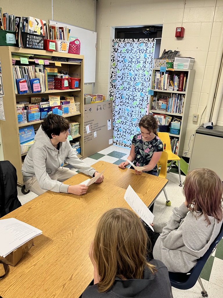 Lincoln academy international students conversing with 5th and 6th graders while sipping on Colombian hot chocolate that traditionally includes adding mozzarella cheese!