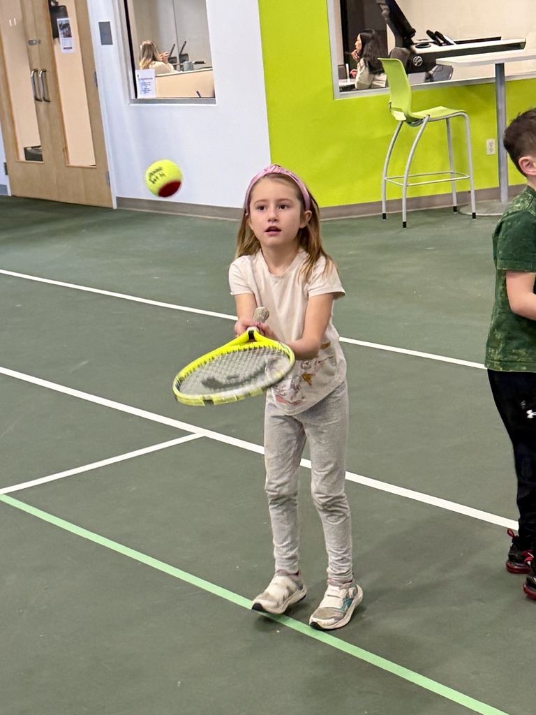2nd graders learning some tennis skills at the Y!