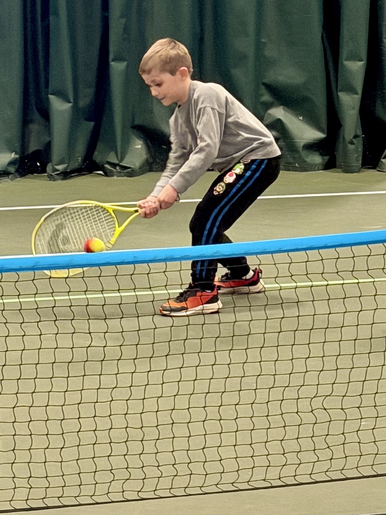 2nd graders learning some tennis skills at the Y!