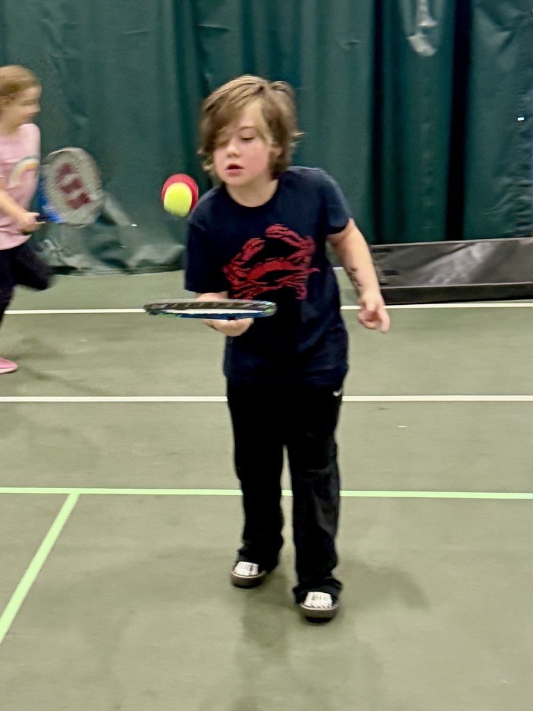 2nd graders learning some tennis skills at the Y!