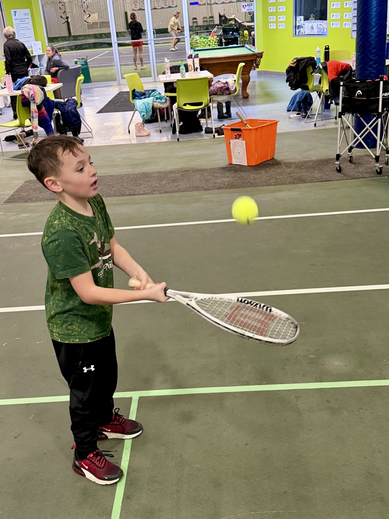 2nd graders learning some tennis skills at the Y!