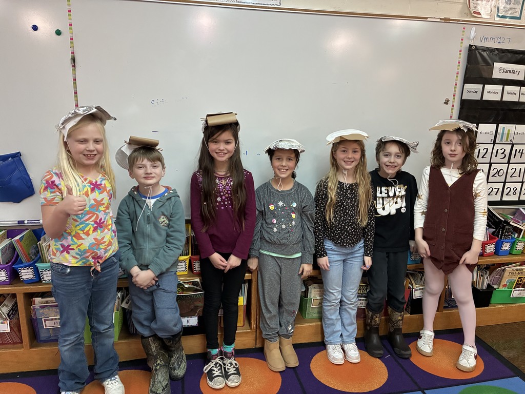 Second graders learn about properties of materials by designing hats that would keep them comfortable on a desert island. 