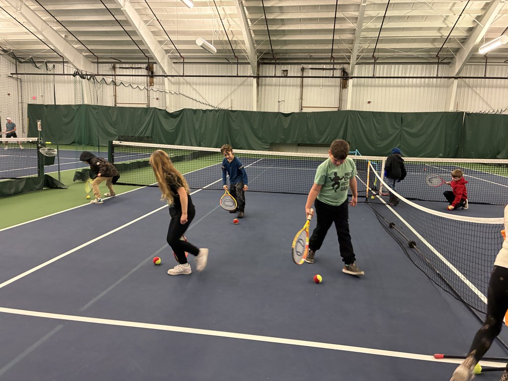 2nd graders learning some tennis skills at the Y!