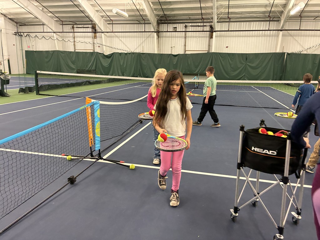 2nd graders learning some tennis skills at the Y!