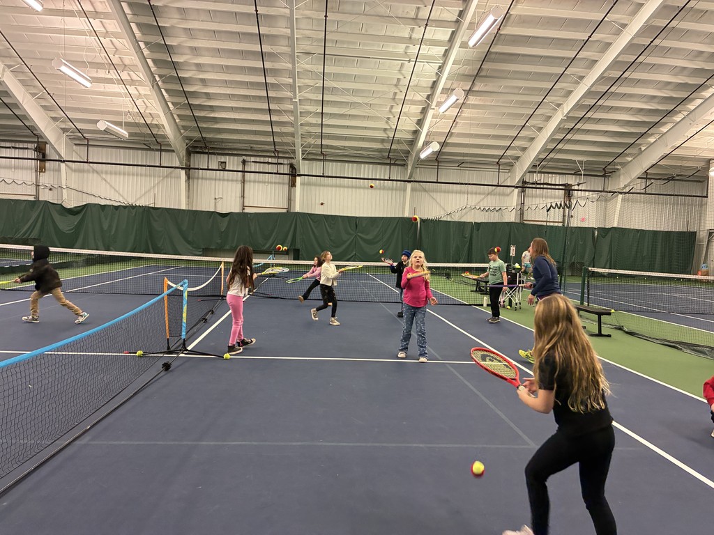 2nd graders learning some tennis skills at the Y!