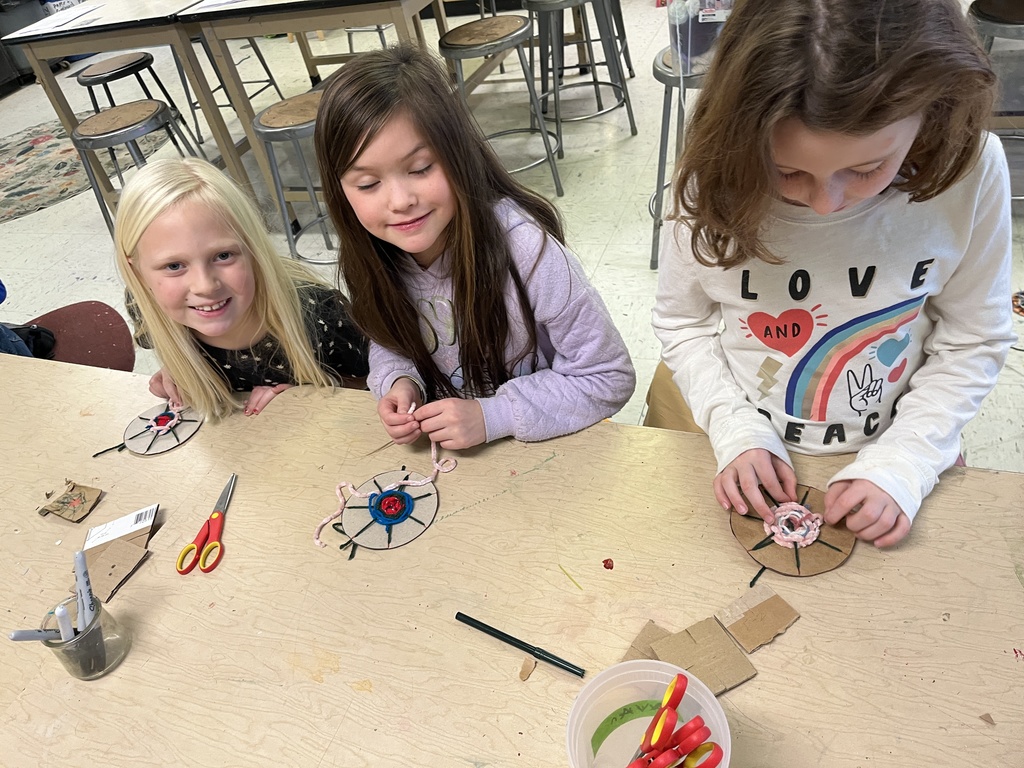 2nd grade weaving in art, working in their fiber unit