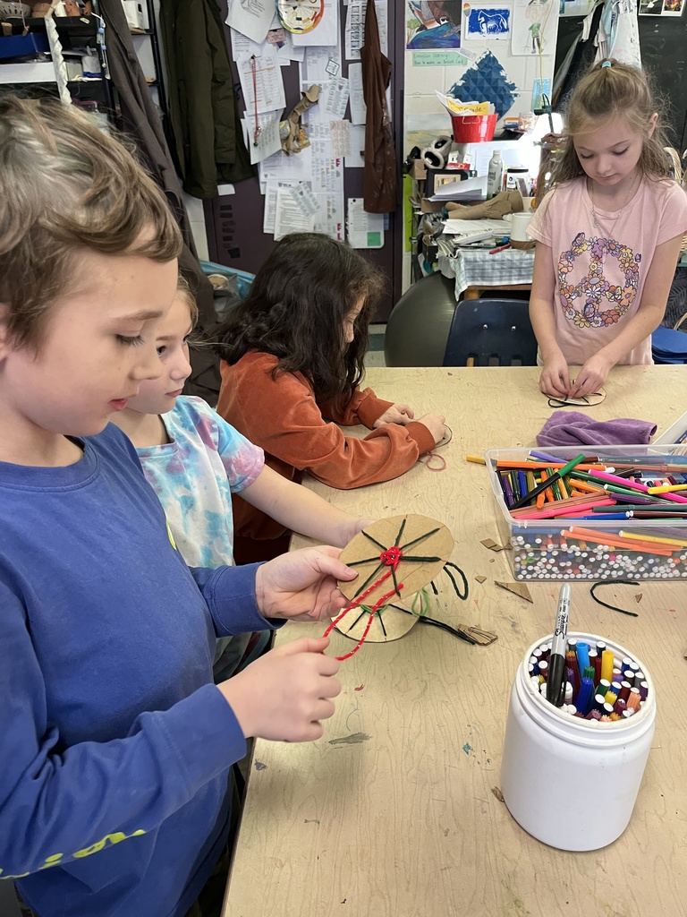 2nd grade weaving in art, working in their fiber unit