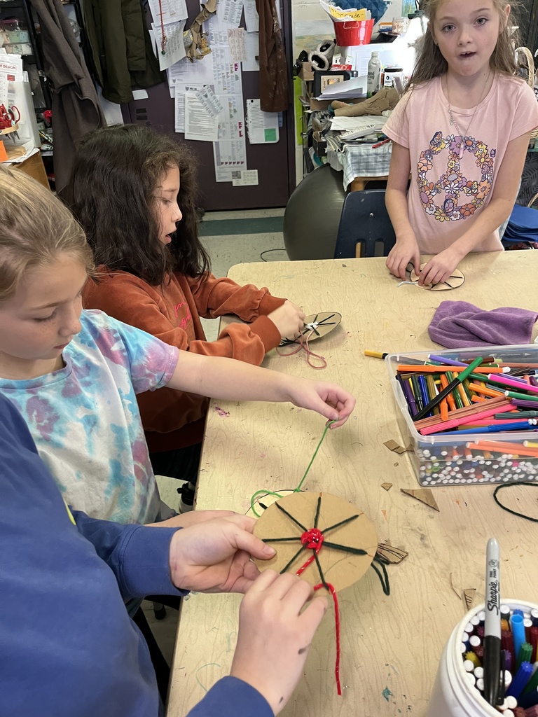 2nd grade weaving in art, working in their fiber unit