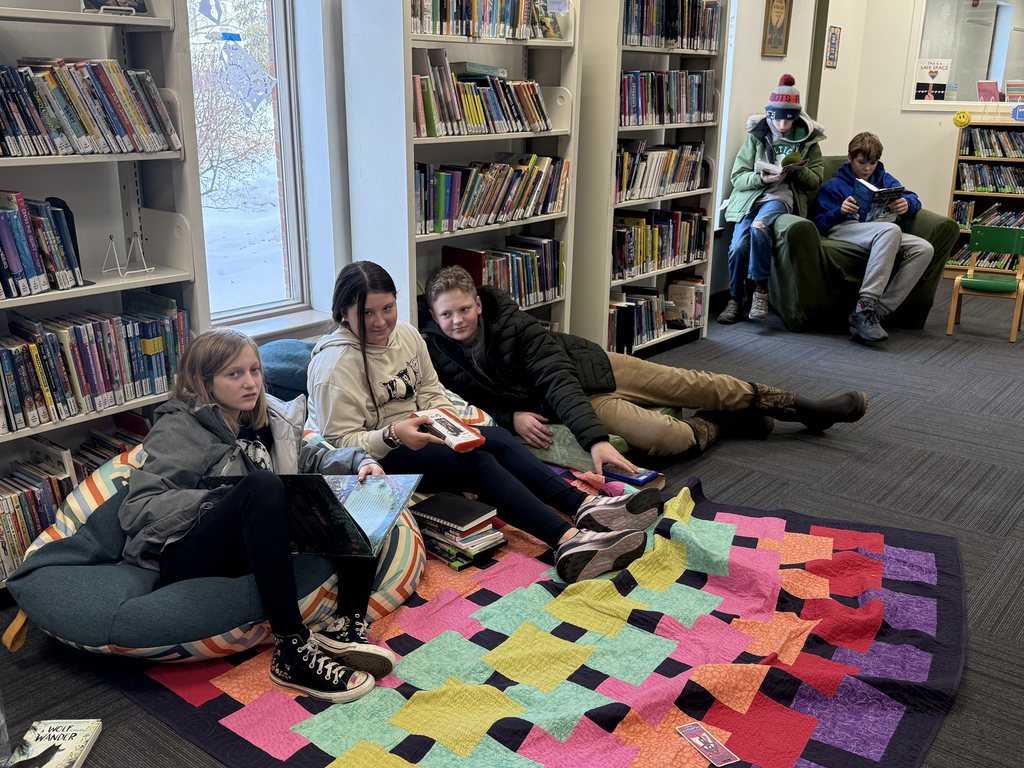 Mrs. Girard's 6th graders enjoy some quiet reading time while visiting Skidompha. 