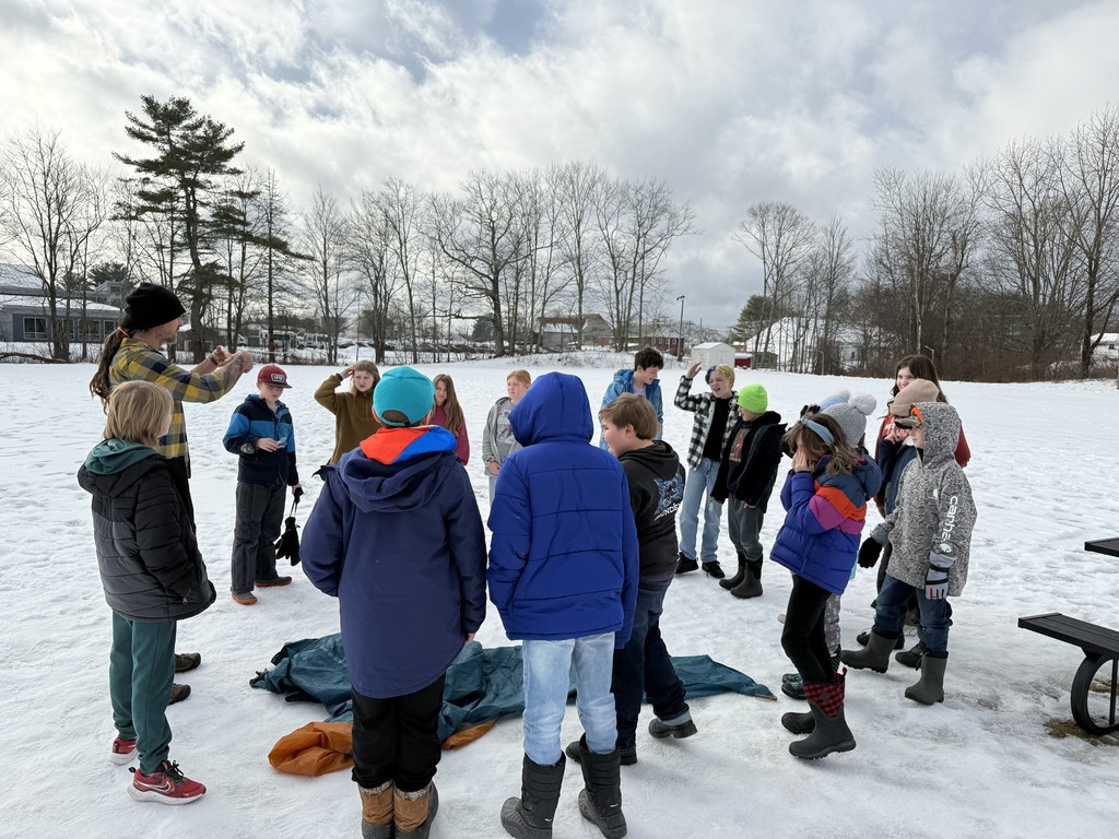Paul, from Hearty Roots, challenges 5th graders to work together so that they can all float on a tiny "raft" together.
