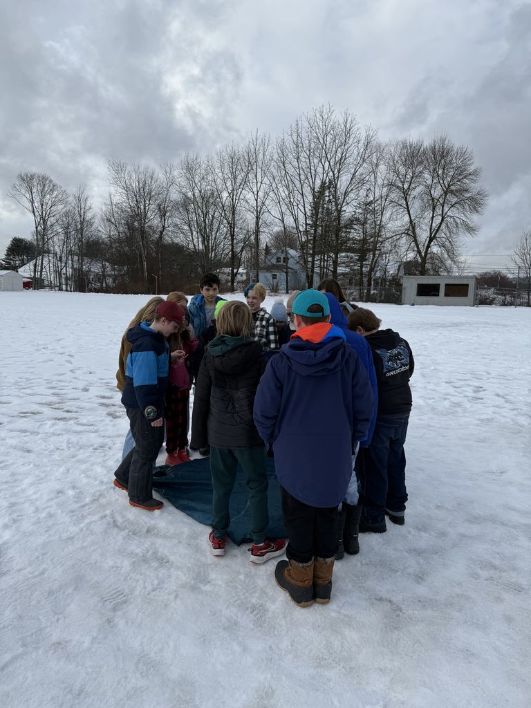 Paul, from Hearty Roots, challenges 5th graders to work together so that they can all float on a tiny "raft" together.
