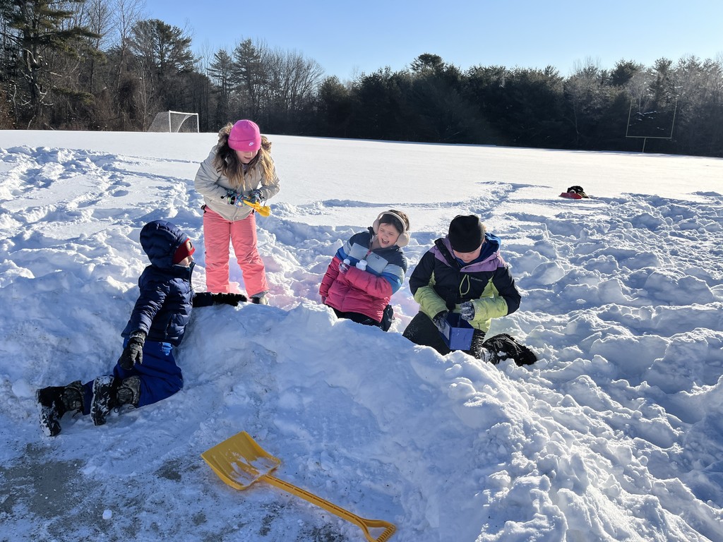 Students working on the igloo village and tunnel obstacle course during art class