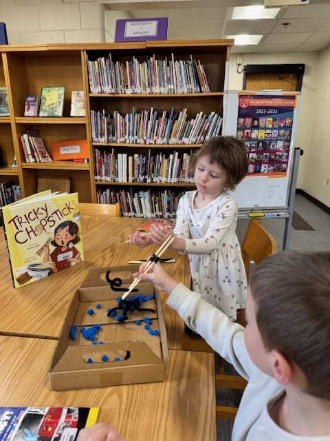 Mrs Ball's class practiced with tricky chopsticks" of their very own after reading the Chickadee Award nominated "Tricky Chopsticks" by Sylvia Chen.