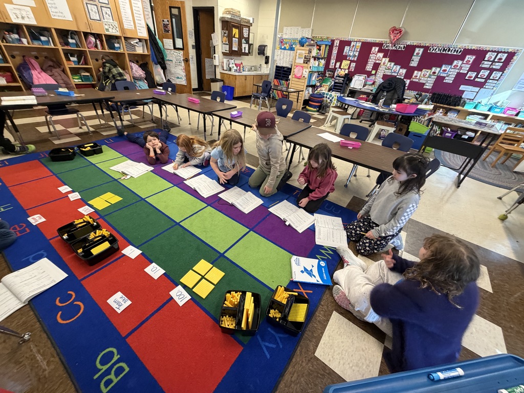 Students are building place value understanding as they create and count 1s, 10s, and 100s out of manipulatives. 