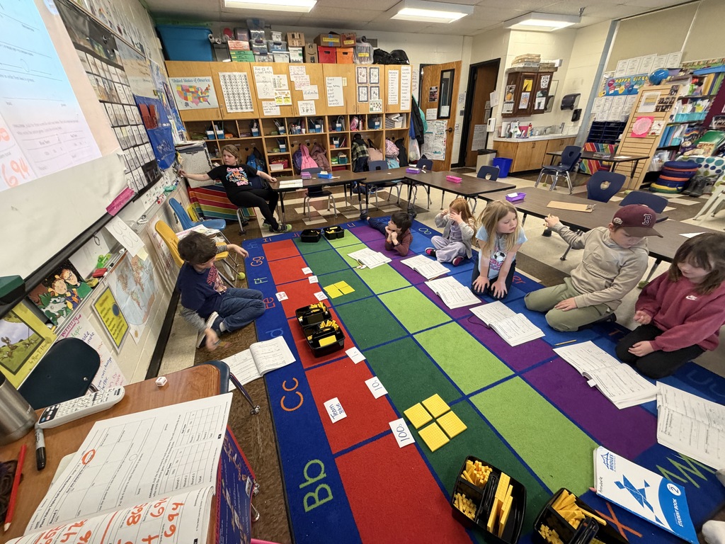 Students are building place value understanding as they create and count 1s, 10s, and 100s out of manipulatives. 