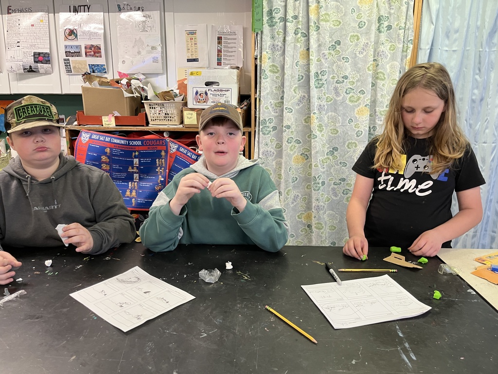 GSB 5th grade students working on the stop motion unit: developing story boards, creating characters, designing sets, and filming their movies.
