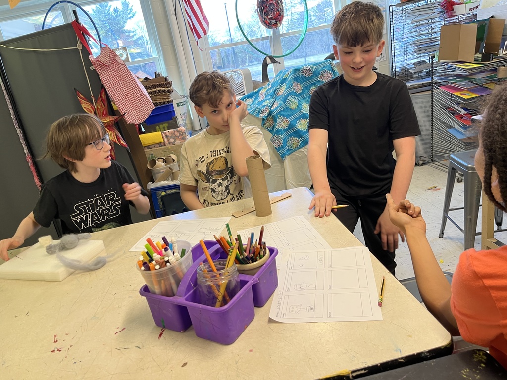 GSB 5th grade students working on the stop motion unit: developing story boards, creating characters, designing sets, and filming their movies.