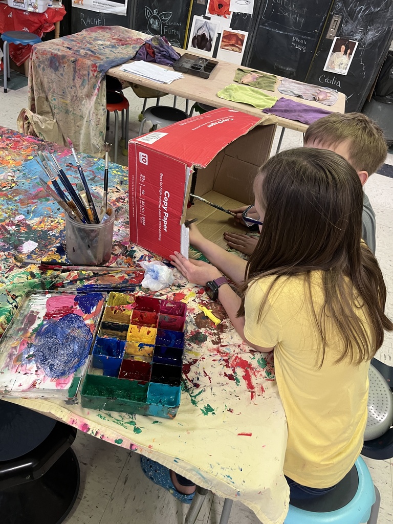 GSB 5th grade students working on the stop motion unit: developing story boards, creating characters, designing sets, and filming their movies.