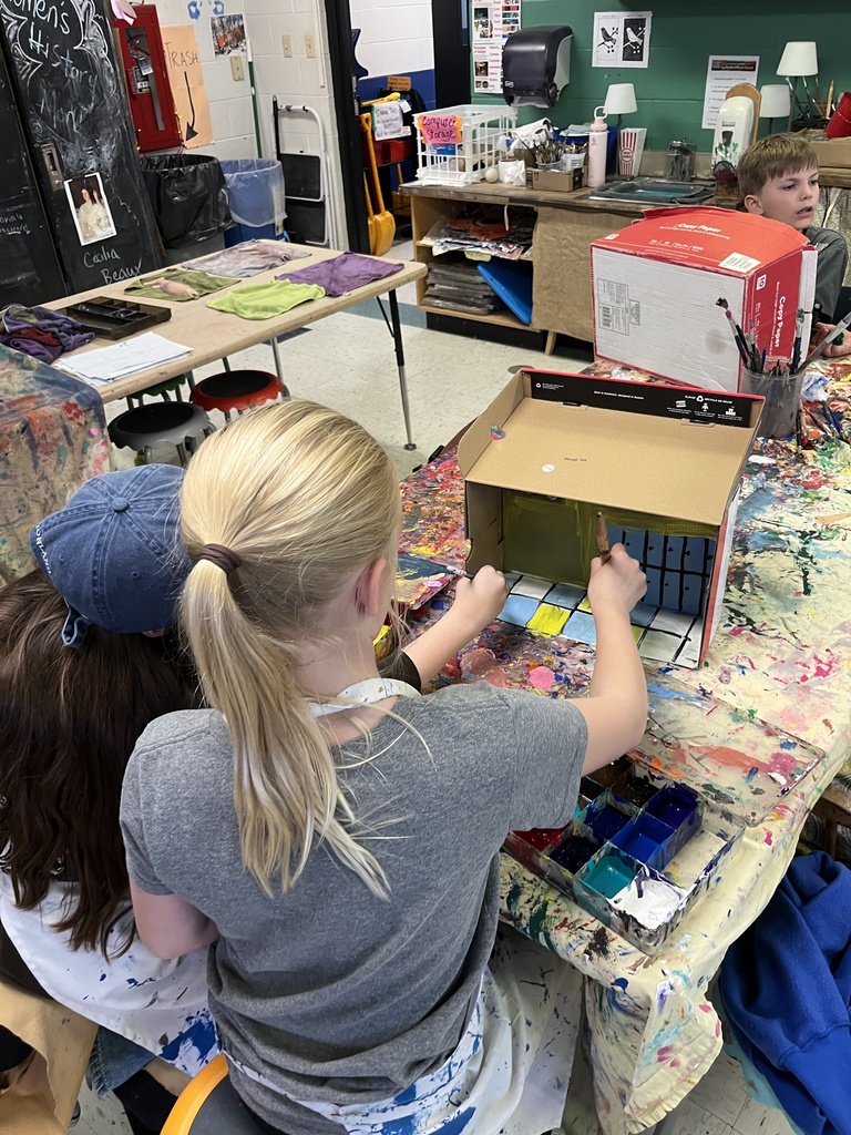GSB 5th grade students working on the stop motion unit: developing story boards, creating characters, designing sets, and filming their movies.