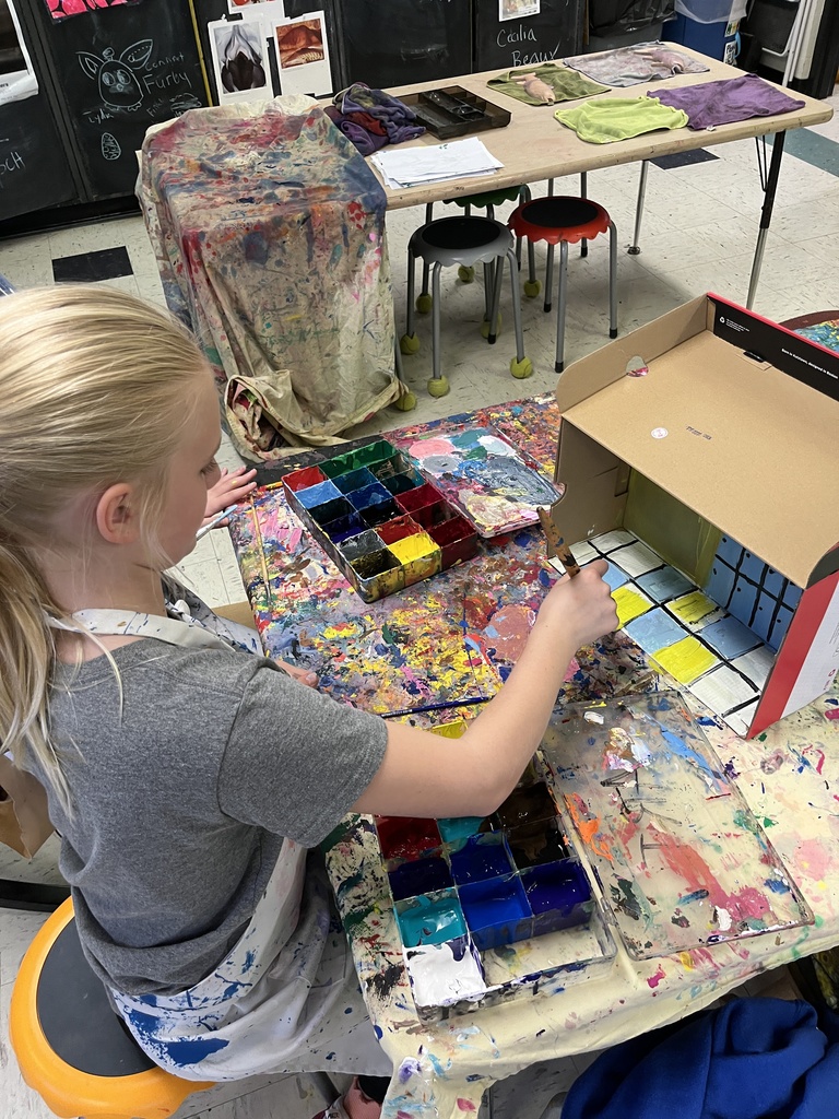 GSB 5th grade students working on the stop motion unit: developing story boards, creating characters, designing sets, and filming their movies.