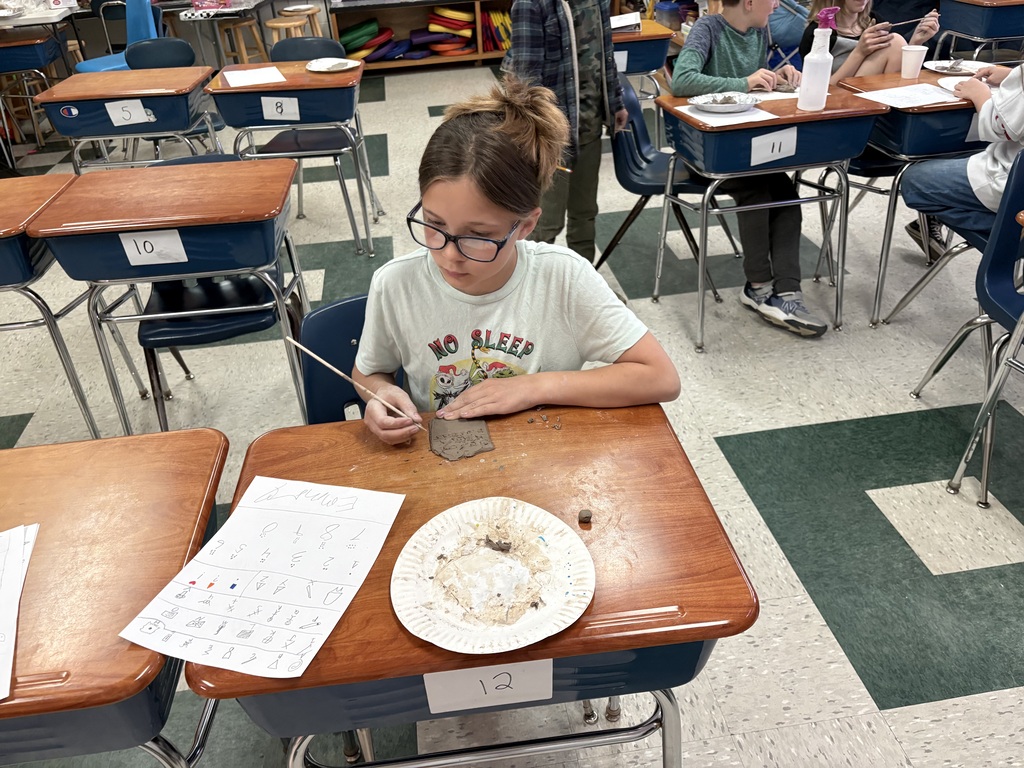 5th grade students prepare glyphs out of clay for their Lost Civilization Project.
