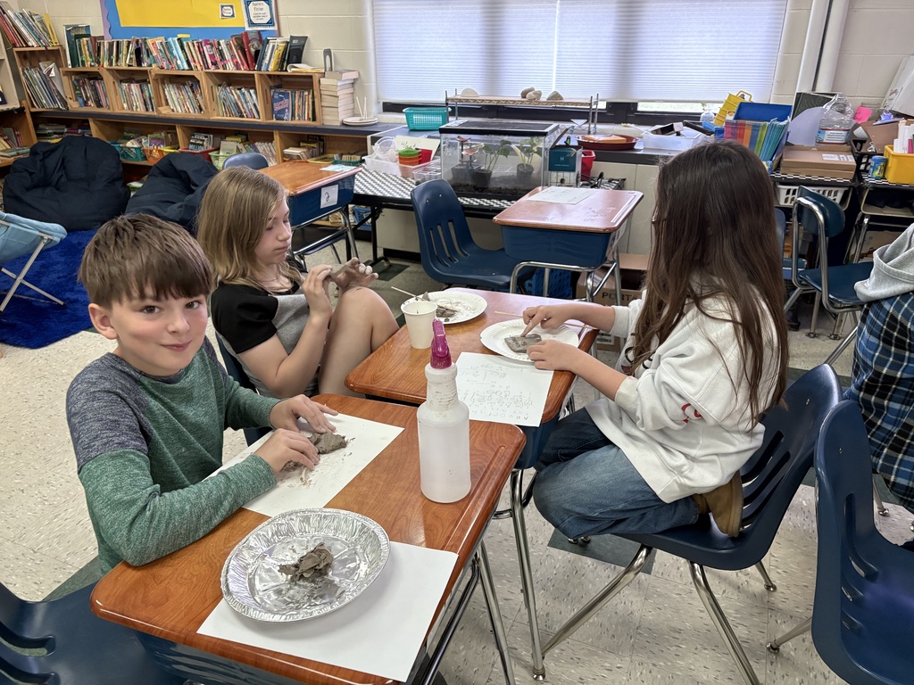 5th grade students prepare glyphs out of clay for their Lost Civilization Project.