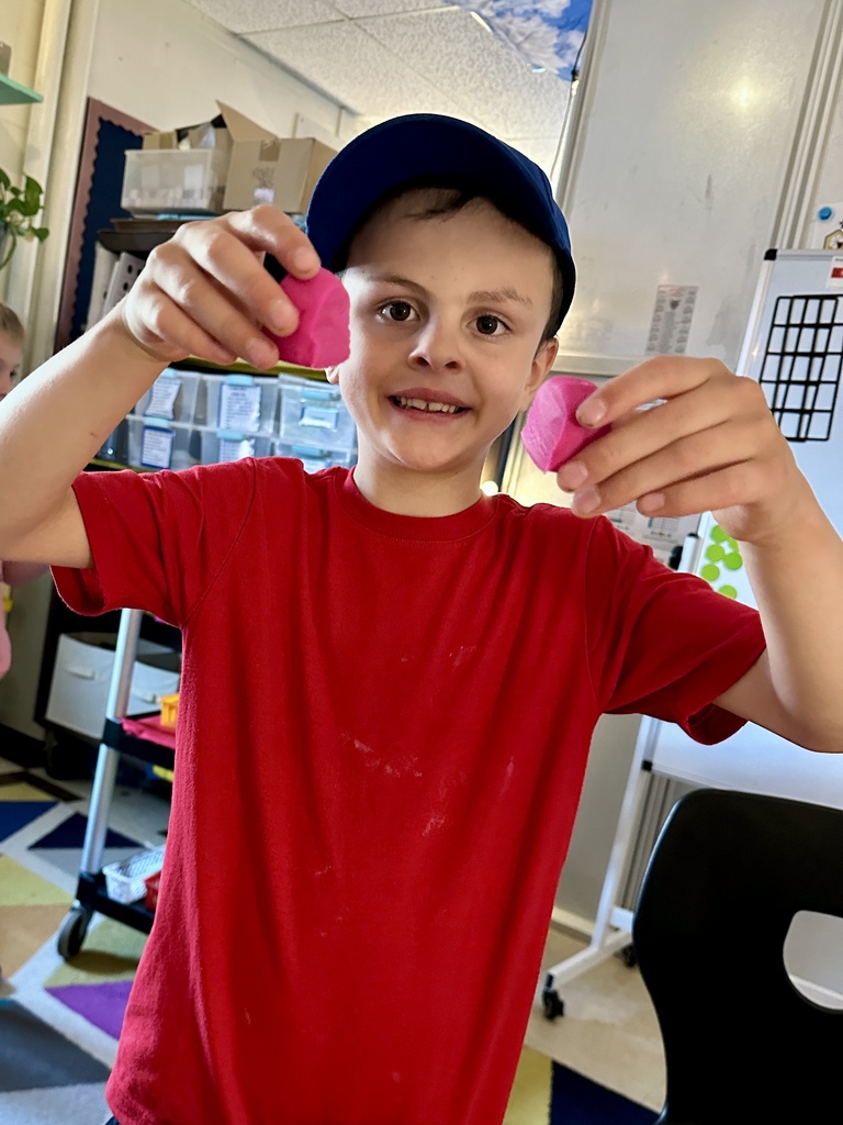 1st grade students practice fractions with play dough