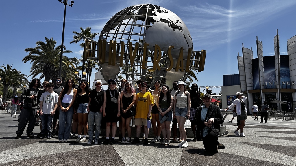 students standing in front of univeral studios hollywood