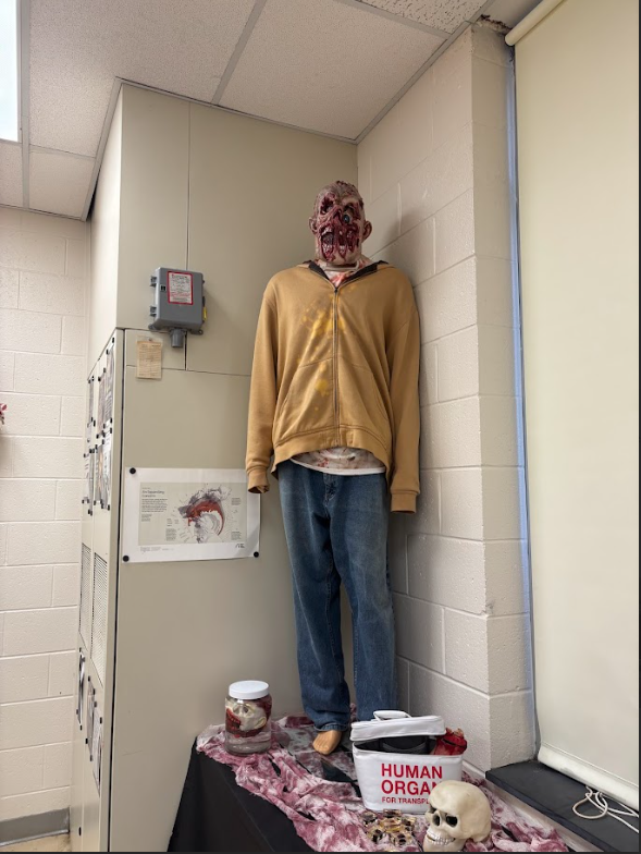 scary mask and mannequin with props underneath