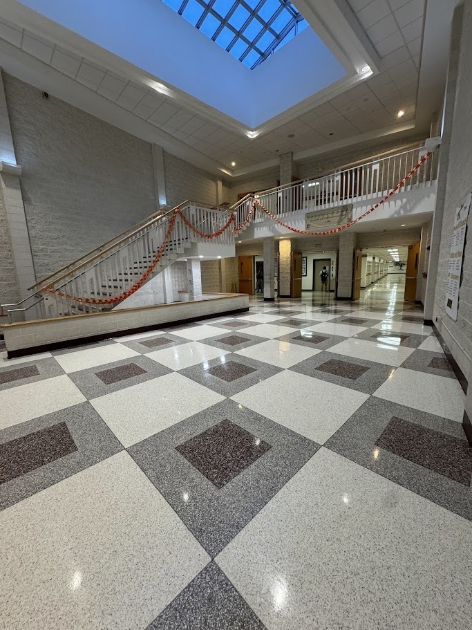 foyer of AHS that has paper chain draped on steps