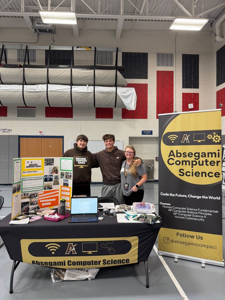 people standing with a banner promoting a magnet