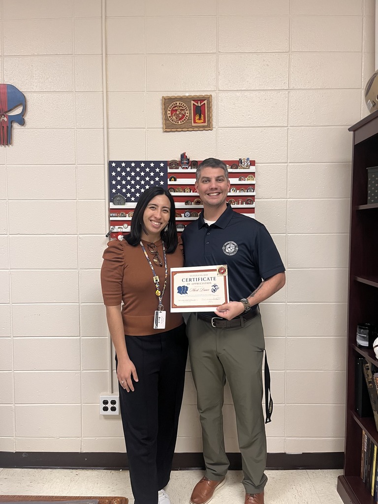 two people standing with a certificate