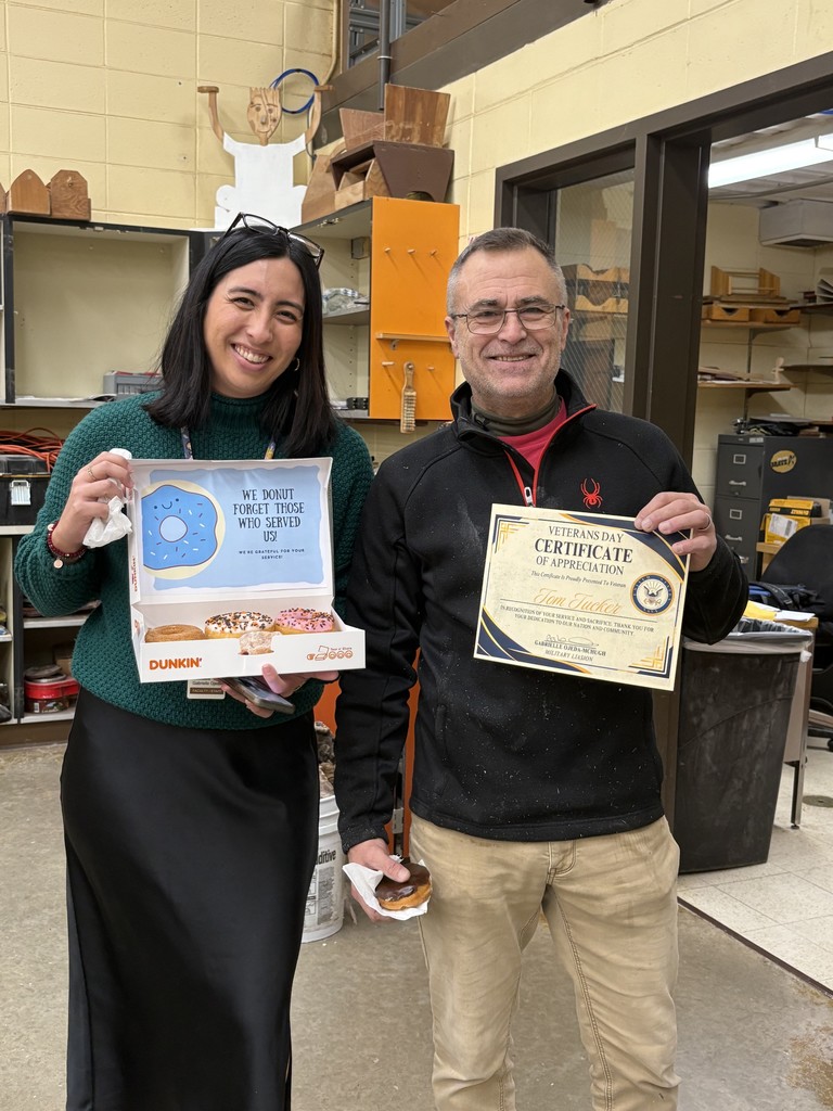 two people standing with a certificate