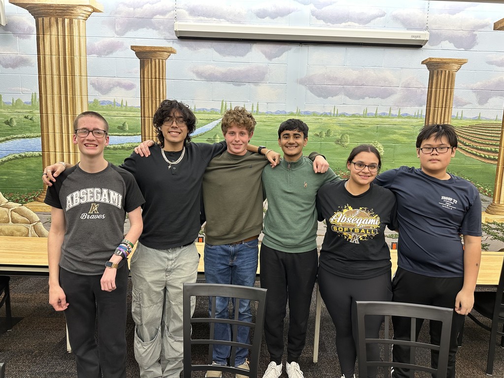 students standing together in front of field background