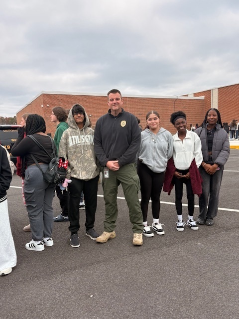group of students students with a someone from prosecutor's office