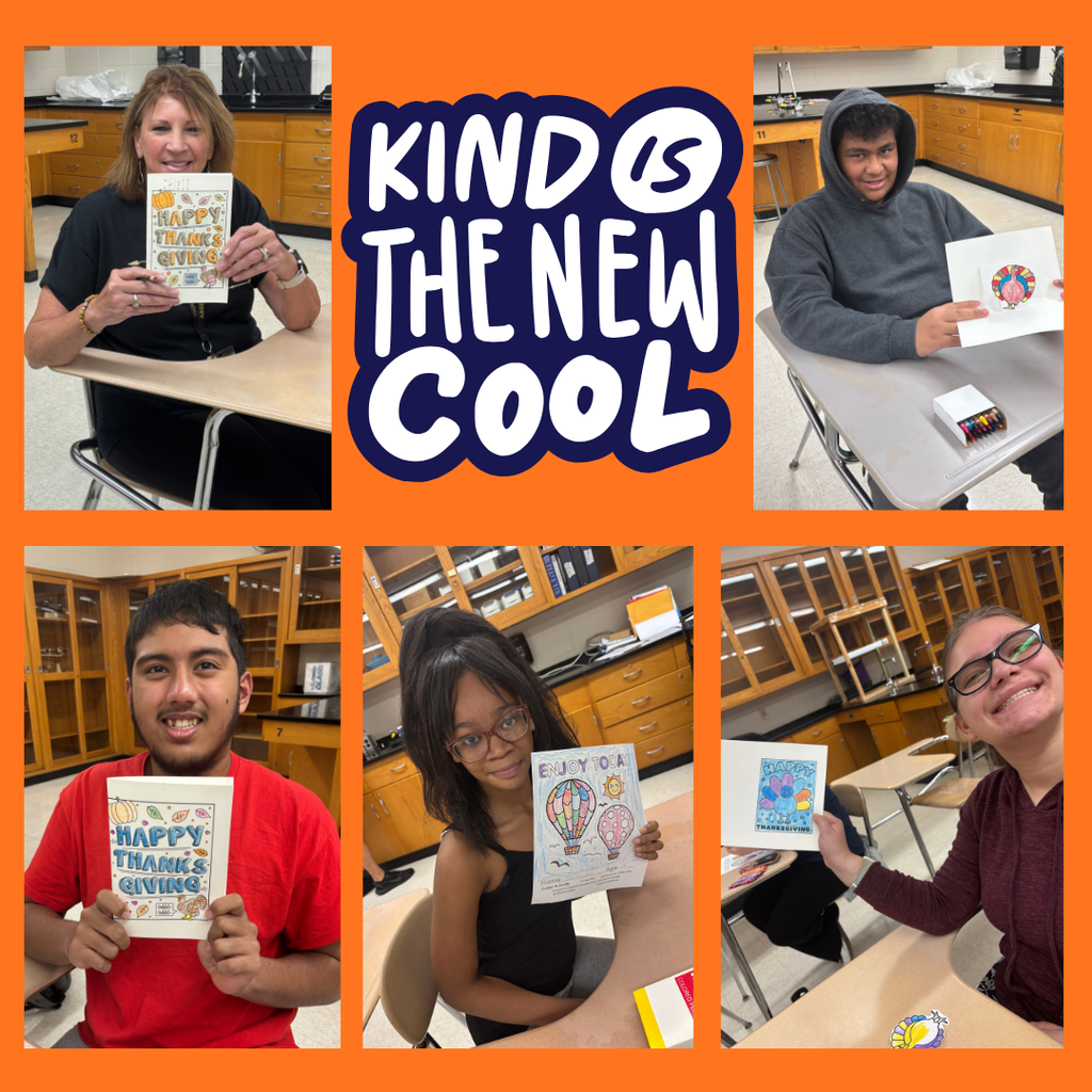 Students holding Thanksgiving Cards and coloring pages.